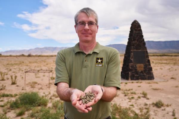 Drew Hamiliton, US Army spokesman for White Sands Missile Range, holds trinitite in his hands. 