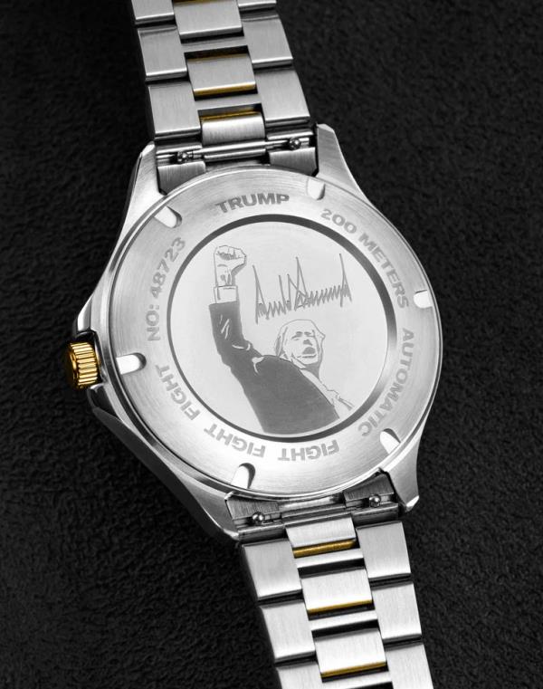 Trump Watch with image of Trump punching fist in the air.
