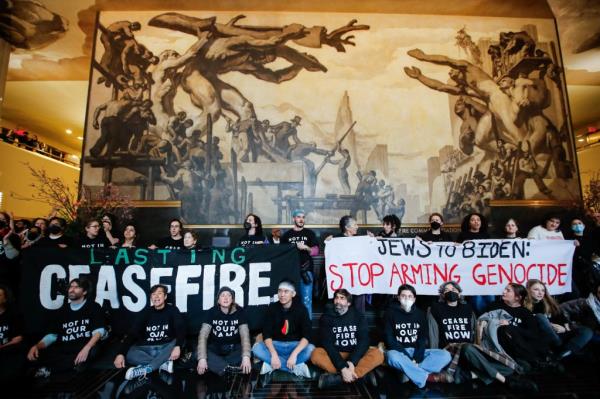 Protestors calling for a cease-fire in Gaza inside Rockefeller Center on Feb. 26, 2024.