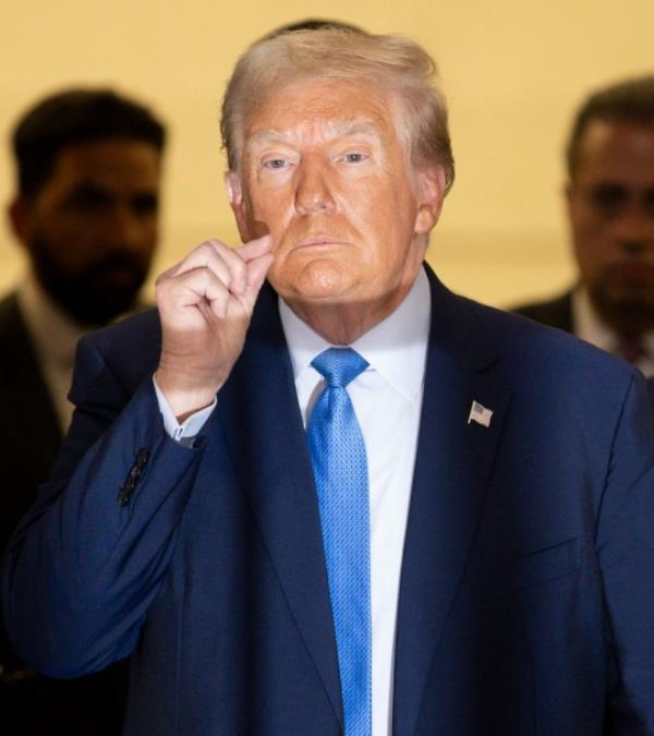 Former President Do<em></em>nald Trump made the zipping lips gesture during a short break in the trial on Mo<em></em>nday morning