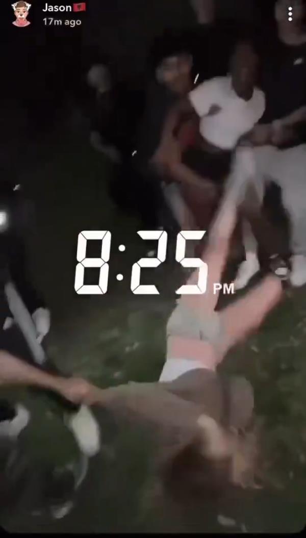 The victim is then seen being dragged down a hill by one of the assailants as o<em></em>nlookers shout -- seemingly egging on the violence -- and record the mayhem.