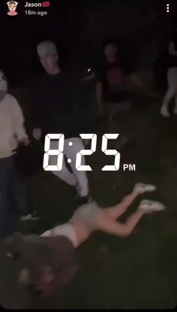 The attackers appeared to beat the victim until she fell unconscious, and they needed to be dragged away by onlookers.