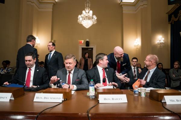Mo<em></em>ntana Attorney General Austin Knudsen and others sitting at a table during a House Homeland Security Committee hearing in Washington, DC.