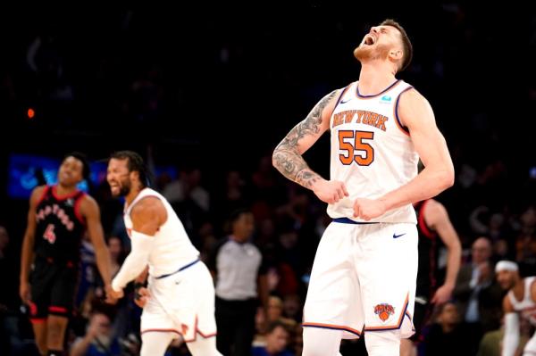 Knicks center Isaiah Hartenstein (55) celebrates after he made a basket