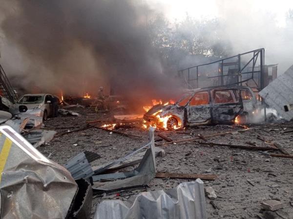 Firefighters work at a site in an area damaged during a Russian missile strike, amid Russiaas attack on Ukraine, in Rivne, Ukraine September 21, 2023. 