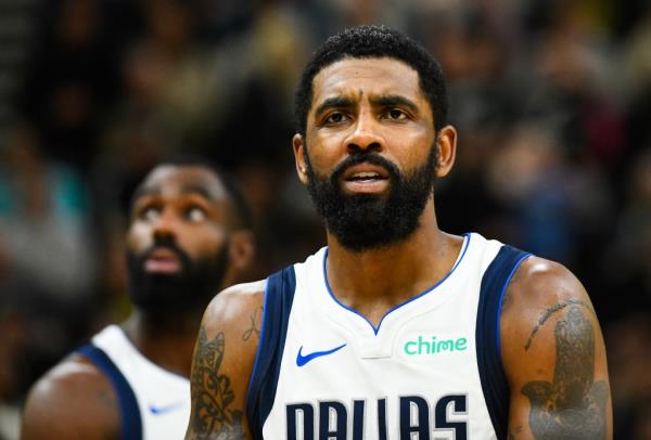 Kyrie Irving #11 of the Dallas Mavericks looks on during a game against the Utah Jazz at Delta Center.