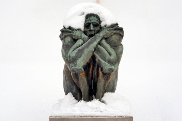 A statue is covered in snow in Erie, Pa., Monday, Dec. 2, 2024. 