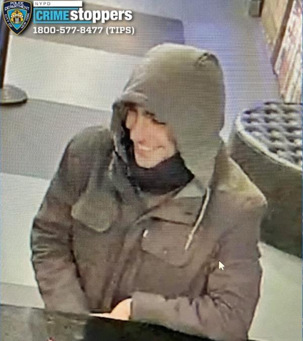 The alleged killer is seen smiling in surveillance video.