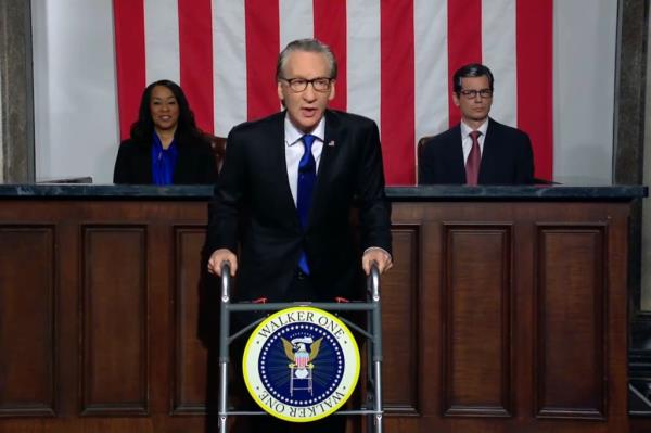 Bill Maher as Biden delivering the state of the unio<em></em>n address while using a walker with a presidential seal and the words 