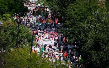 Protesters march on the Democratic Natio<em></em>nal Co<em></em>nvention after a rally at Unio<em></em>n Park