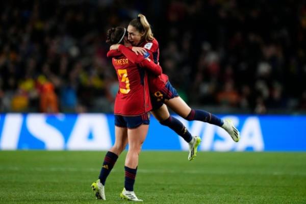 Spanish players in red and blue home kit