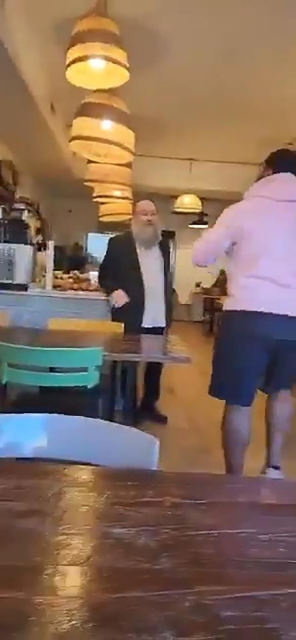 The man yelled at the people inside the cafe that 
