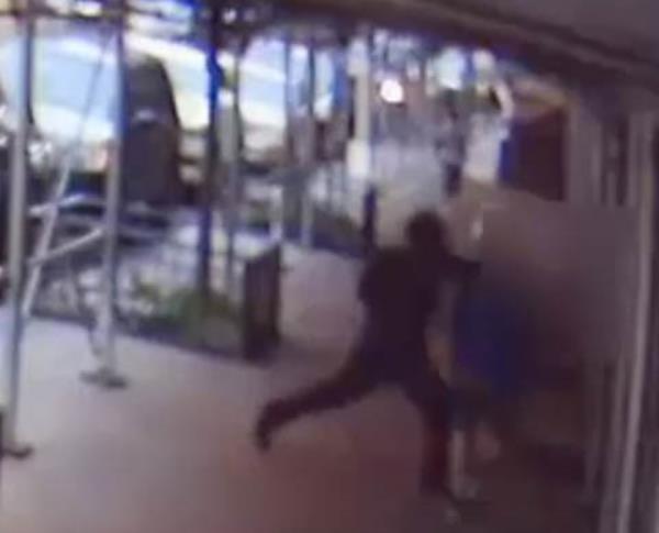 Rick Moranis being punched in the head by a man in a random attack on Central Park West, captured in security footage.