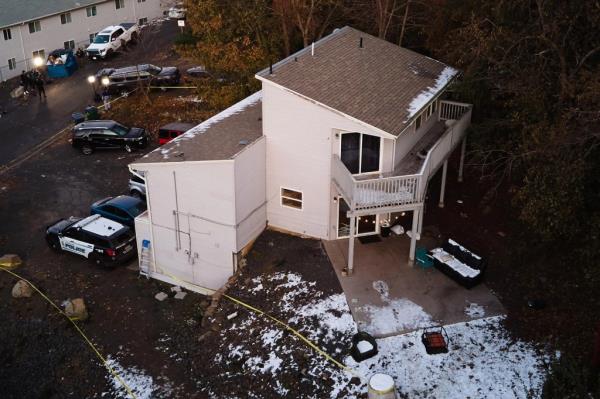 Suspect surveilling a house with snow on the ground