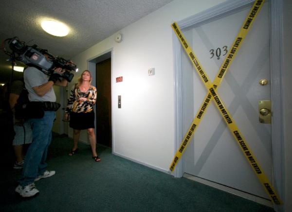 The media stand outside the apartment wher<em></em>e fugitive crime boss James