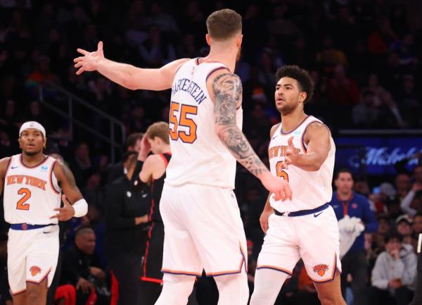 Quentin Grimes is co<em></em>ngratulated by his teammates after one of many of his successful three point shots during the first half against the Toro<em></em>nto Raptors.
