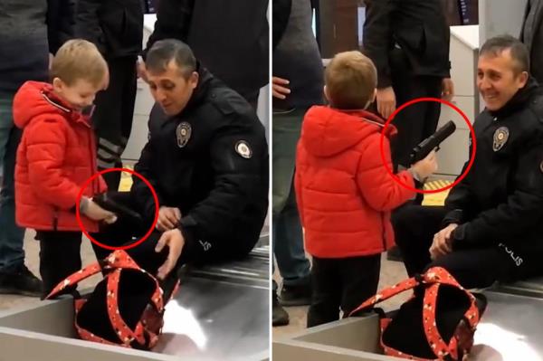 Officer smiles while looking at 6-year-old's plastic guns 