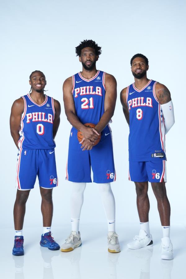 Tyrese Maxey #0, Joel Embiid #21, and Paul George #8 of the Philadelphia 76ers pose for a portrait during NBA Media Day on September 30, 2024 at the Philadelphia 76ers Training Complex in Camden, New Jersey. 