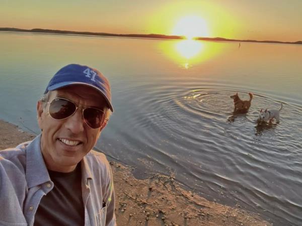 Hugo Marin wears 47 hat in front of beach