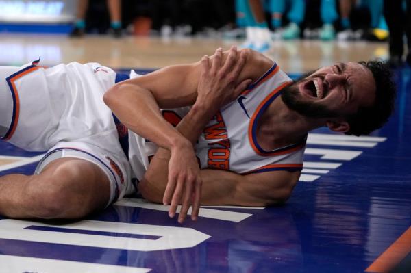 New York Knicks' Landry Shamet reacts after an injury during the second half of a preseason NBA basketball game against the Charlotte Hornets, Tuesday, Oct. 15, 2024, in New York. 