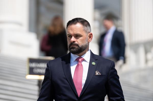 Rep. Cory Mills, R-Fla., walks down the House steps of the Capitol on Thursday, May 18, 2023