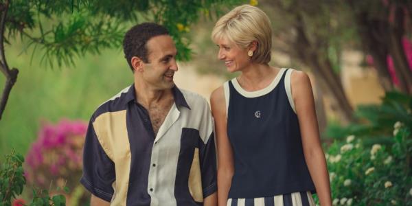 Khalid Abdalla as Dodi Fayed and Elizabeth Debicki as Princess Diana smiling at each other. 