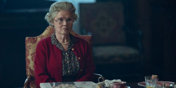 Imelda Staunton as Queen Elizabeth, smiling slightly. 