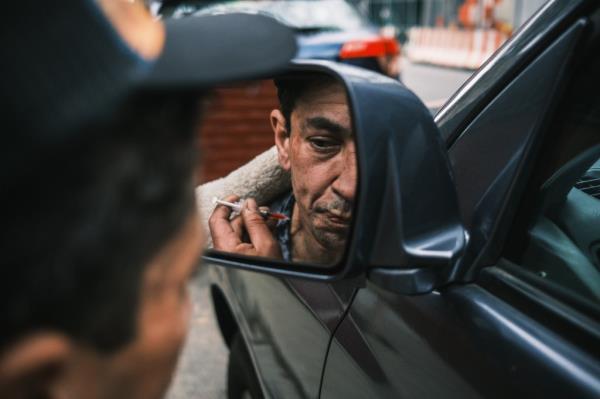 David Gonzalez, 41, does a shot of heroin in NYC on May 3, 2022.