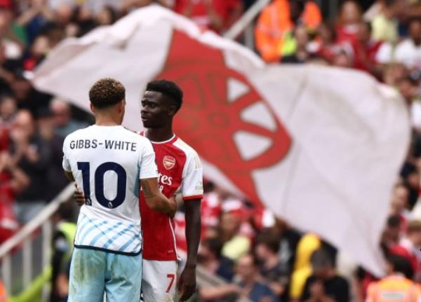 Morgan Gibbs-White with Bukayo Saka