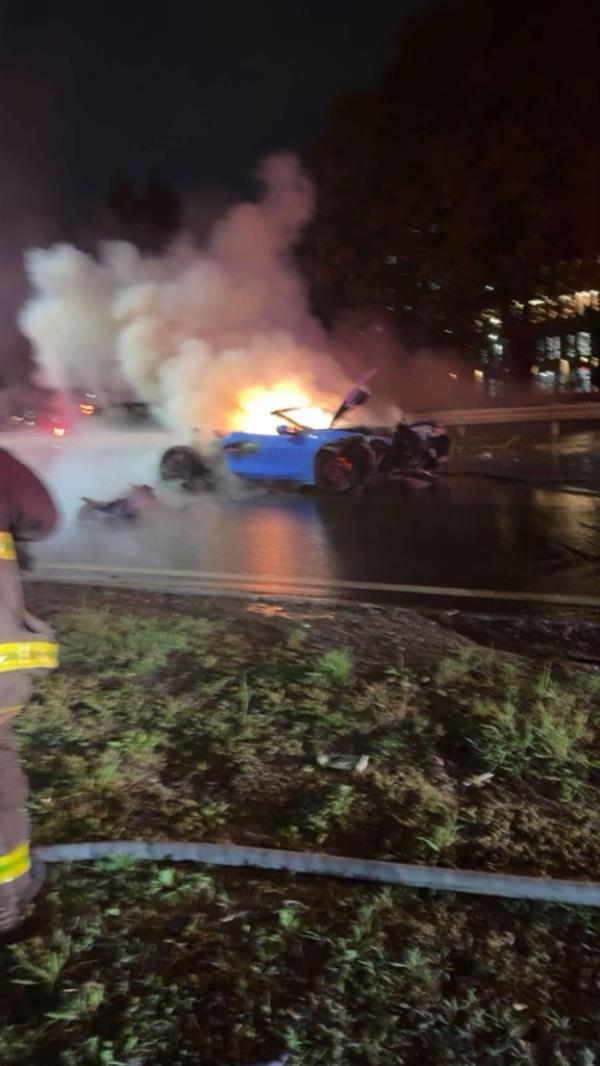 A car in flames after a crash on the Belt Parkway in Brooklyn on May 3, 2024.