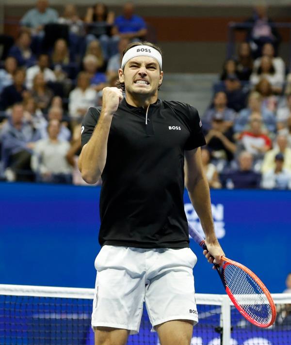 Taylor Fritz (USA) [12] reacts as he plays Frances Tiafoe (USA) [20] during their match on Arthur Ashe Stadium. 