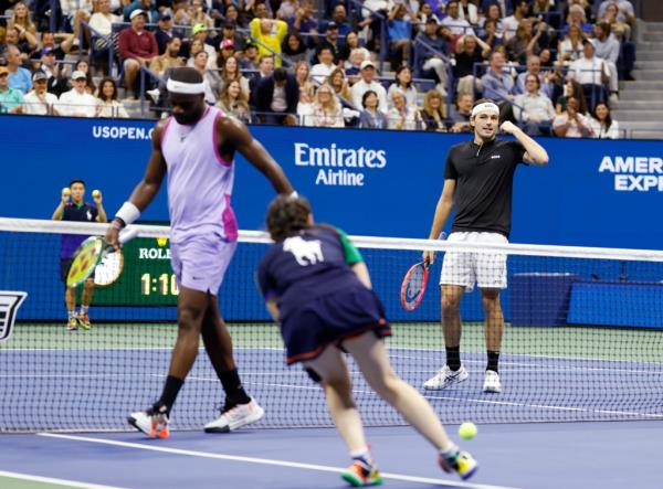 Taylor Fritz (USA) [12] reacts after Frances Tiafoe (USA) [20] misses a shot during their match on Arthur Ashe Stadium. 
