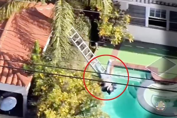 Viral police drone video shows moment a burglary suspect fell from a ladder into a pool at the Beverly Homes he had broken into
