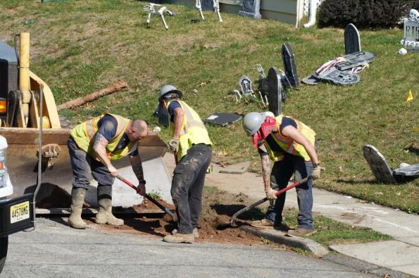 Municipal workers installing a new water line