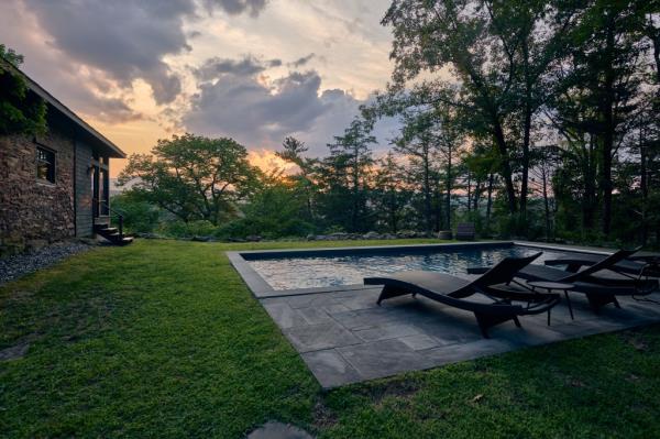 The estate comes with a pool and mountain views
