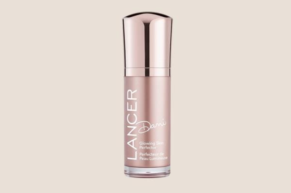 A bottle of Dani Glowing Skin Perfector, a skincare product favored by Jessica Biel