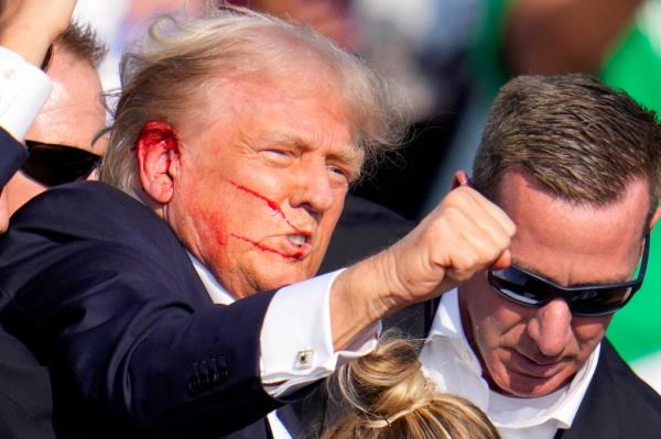Republican presidential candidate former President Do<em></em>nald Trump reacts following an assassination attempt at a campaign event in Butler, Pa., on Saturday, July 13, 2024.
