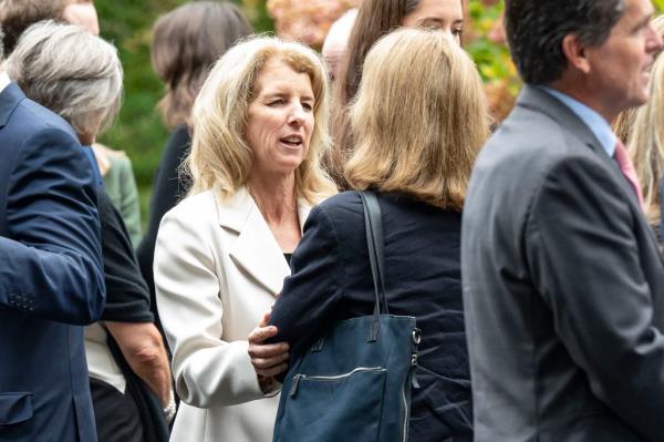 Rory Kennedy and Mark Shriver at the funeral of Ethel Skakel Kennedy at Our Lady of Victory, Centerville, MA, with a woman offering co<em></em>nsolation to another.