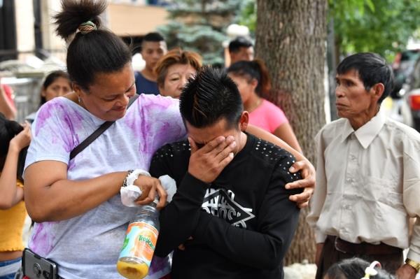 Mourners weep after Alysson Pinto-Chaumana's death.