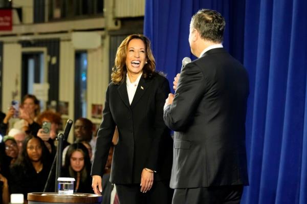 Democratic presidential nominee Vice President Kamala Harris, left, and second gentleman Doug Emhoff visit a watch party at Cherry Street Pier after the presidential debate in Philadelphia, Tuesday, Sept. 10, 2024