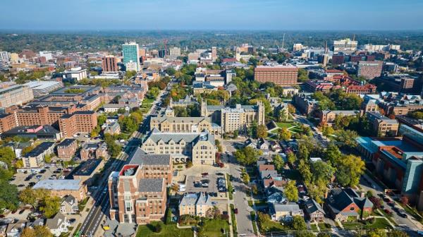 Aerial view of University of Michigan campus and downtown Ann Arbor, showcasing historical and modern architecture