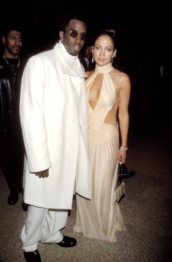 P Diddy with J-Lo smiling. 