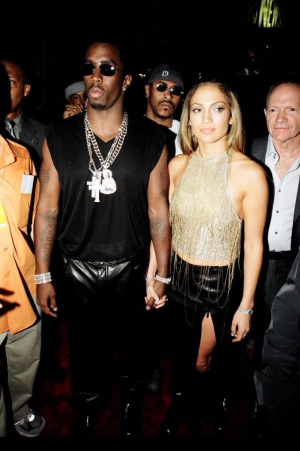 P. Diddy holding hands with J-Lo. 