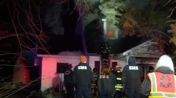 The house mid-fire.