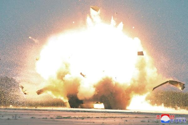 A huge explosion on what appears to be a tank. There's a ball of flame and fire.