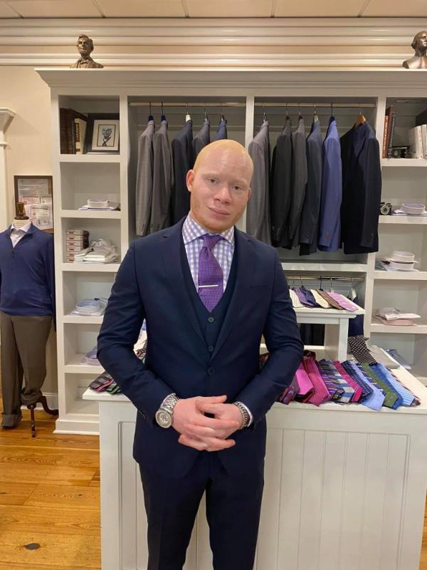 Page allegedly used the stolen funds to make lavish purchases including 16 blue suits.