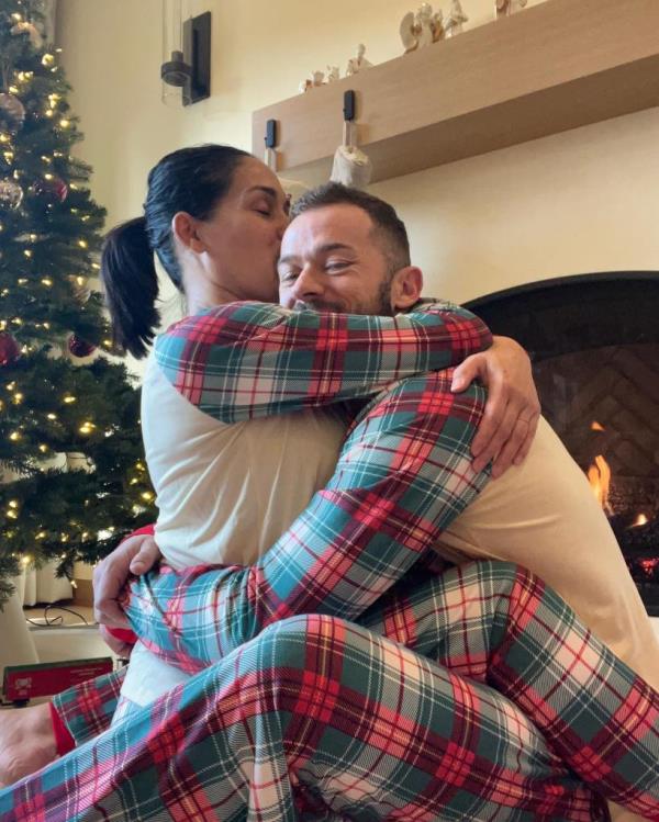 Artem Chigvintsev and Nikki Bella celebrating Christmas Day 2022.