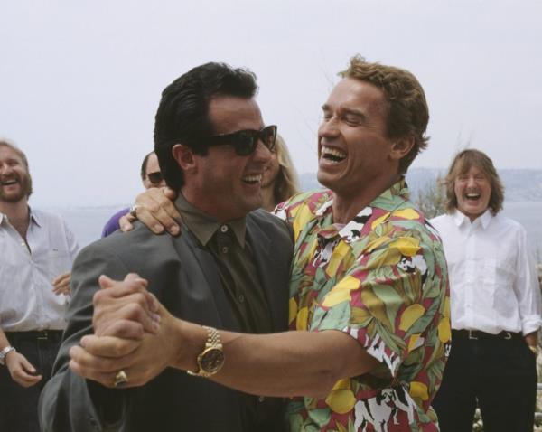 Arnold Schwarzenegger and Sylvester Stallone pictured in 1990.