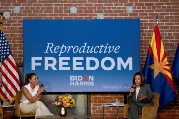 U.S. Vice President Kamala Harris discussing reproductive rights with actress Francia Raisa on the second anniversary of Roe v. Wade being overturned in Phoenix, Arizona
