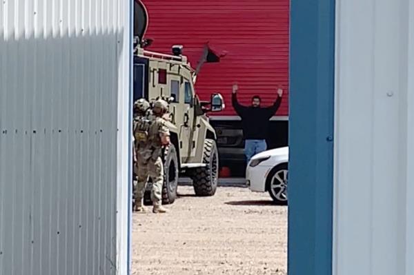 man surrenders after pursuit